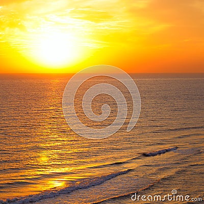 Bright sun rise over beach Stock Photo