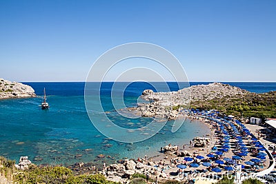 Beach off the coast of the island of Rhodes in Faliraki, Greece. Seaside landscape. Rocky coast and sea.Bay off the coast of falir Editorial Stock Photo