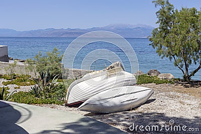 Beach and old boats close-up on a spring, sunny day Greece, Peloponnese Stock Photo