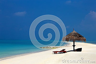 Beach with a parasol Stock Photo