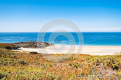Beach Pit on Breton coastline in France Frehel Cape region with its sand, rocks and moorland in summer Stock Photo