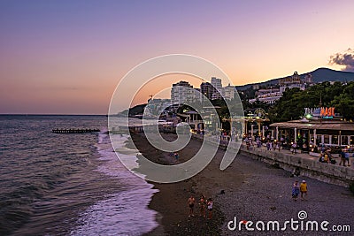 Beach and promenade at sunset, 09/07/2019, Yalta, Crimea Editorial Stock Photo