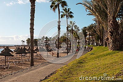 Beach promenade walkway , sidewalk near beach, Playa de Las Amer Editorial Stock Photo