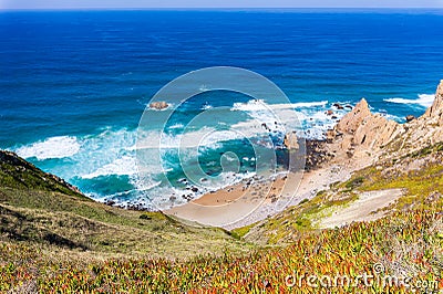 Beach among rocks. Ursa Beach near Cape Roca, Atlantic Ocean coast in Portugal Stock Photo