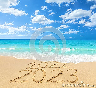 2022 and 2023 on a beach sand Stock Photo