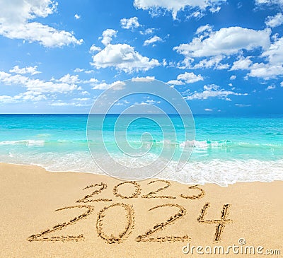 2023 and 2024 on a beach sand Stock Photo