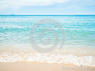 Beach Sand on Sea Background,Shore Summer with White Wave and Blue Ocean Beautiful Seascape Nature for Tourism Vacation Travle Stock Photo