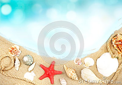 Beach sand seashells background,blue water summer backdrop. Stock Photo