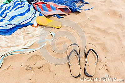 Beach Sand Towels People Slippers Black Yellow Stock Photo