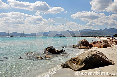 A beach in Sardegna, Sardinia, Italy Europe with rocks and sailing boats Stock Photo