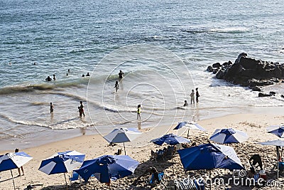 Beach scene on a busy spring day with people at leisure Editorial Stock Photo
