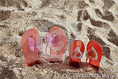 Beach Slippers in sand Stock Photo