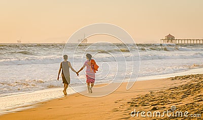 Beach Stroll - Huntington Beach - California Editorial Stock Photo