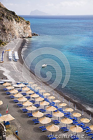 Beach with sunshade umbrellas Stock Photo