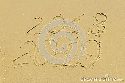 On the beach there is an inscription on the sand 2018 2019, rest Stock Photo