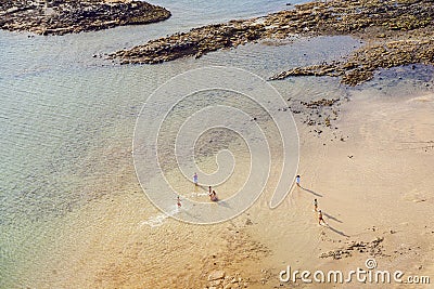 Beach with tourists in summer in Arrecife, Spain Stock Photo