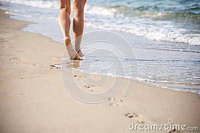 Beach travel - woman walking Stock Photo