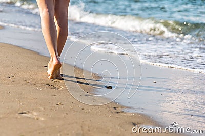 Beach travel - woman walking Stock Photo