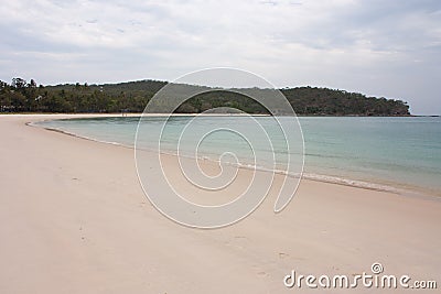 A beach and a tropical forest in the background on the Great Keppel Island in the Tropic of Capricorn area in Central Queensland Stock Photo