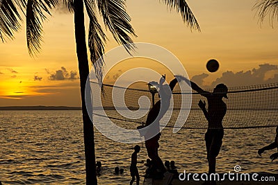 Beach volleyball, sunset on the tropics Stock Photo