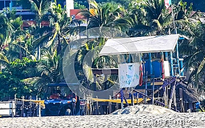 Beach watchtower with Mexican flag in Puerto Escondido Mexico Editorial Stock Photo