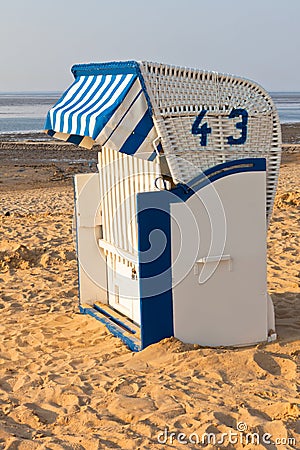 Beach wicker chair strandkorb in Northern Germany Stock Photo