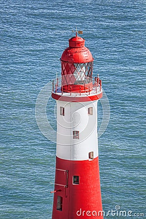 Beachy Head Lighthouse against blue sea near the Eastbourne, East Sussex, England Stock Photo