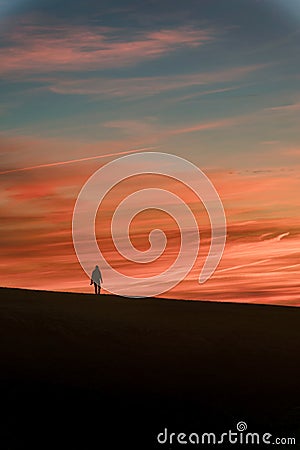Beachy Head moon and sunset silhouette, United Kingdom Stock Photo