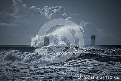 Beacon and pier under heavy storm Stock Photo