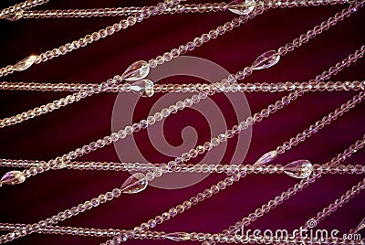 Strung crystals hanging in a backdrop Stock Photo