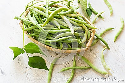 Bean pods in wicker baskets. Stock Photo