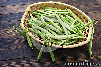 Bean pods in wicker baskets. Stock Photo