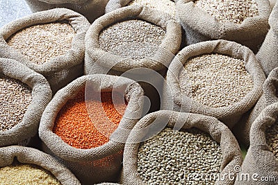 Beans, rice, lentils, oats, wheat, and barley in jute sack Stock Photo