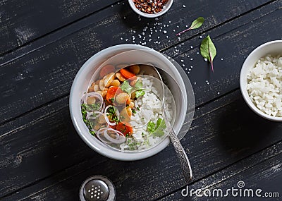 Beans in tomato sauce and rice - a delicious vegetarian lunch. Stock Photo