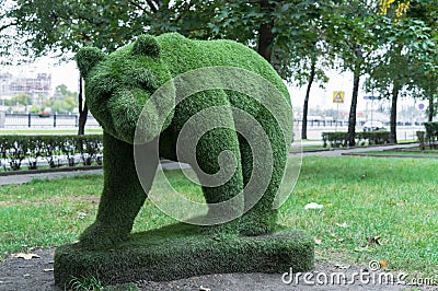 Bear from of artificial lawn grass, topiary figure Stock Photo