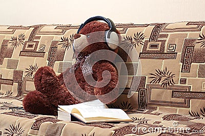 Bear, headphones, book Stock Photo