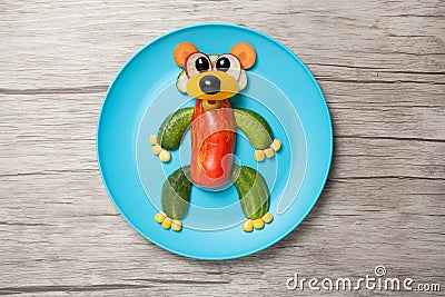 Funny vegetable bear made on plate and table Stock Photo