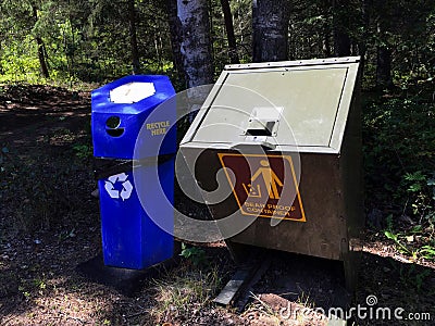 Bear Proof Container Next to Recycling Container Stock Photo