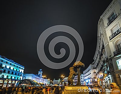 Bear and strawberry tree statue in Puerta del Sol at night Editorial Stock Photo