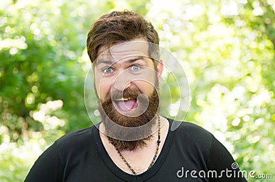 The beard with depth and texture. Bearded man smiling with stylish mustache and beard shape. Unshaven hipster with Stock Photo