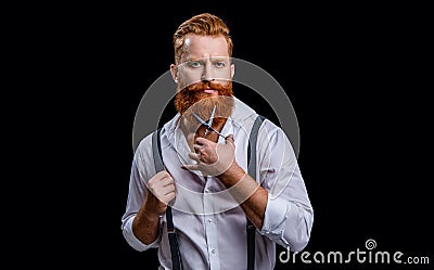 bearded barbershop man in studio. barbershop man with scissors. photo of barbershop man Stock Photo