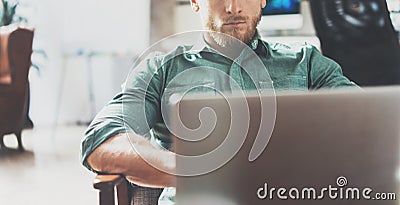 Bearded Businessman working Laptop modern Interior Design Loft Studio Office.Man relaxing Vintage chair.Use contemporary Stock Photo