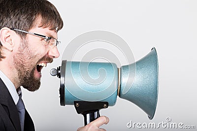 Bearded businessman yelling through bullhorn. Public Relations. man expresses various emotions. photos of young Stock Photo