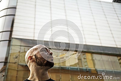 Ambitious serious young businessman looking into the future concept Stock Photo