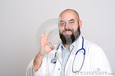 Bearded doctor in white coat- all right Stock Photo