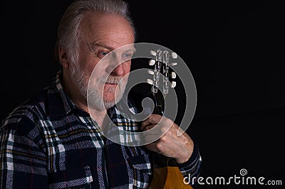 Bearded elderly man with mandolin Stock Photo