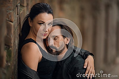 Charming woman embracing her restful man stock photo Stock Photo