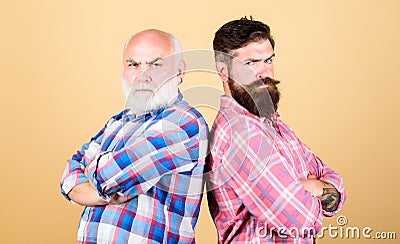 Bearded friends. Hairdresser salon. Barbershop concept. Men bearded hipster stand back to back. Family team. Brutal guys Stock Photo