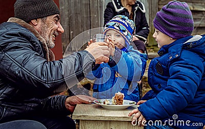 Bearded grandfather with two little grandchildren brothers Stock Photo