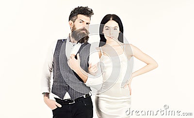 Bearded hipster with bride dressed up for wedding ceremony. Woman in wedding dress and man in vest. Couple in love Stock Photo